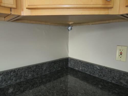 Water damage under cabinet